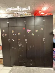  1 Brown cupboard with additional racks