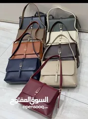  9 شنتة ستاتي اصلي مع العلبة  جلد طبيعي جودة عالية جدا  سحاب ويد طويلة  مقاس 21×27