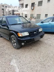  2 كيا سبورتج 2001 لون اسود للبيع