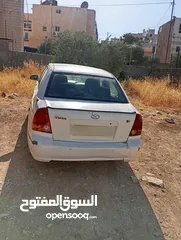  1 سيارة هونداي فيرنا 2003ميكانيكيات جيدة جدا وعيوب بسيطة بالبودي