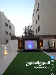 1 شقة شبه أرضي مع حديقة وكراج مستقل بأجمل مواقع ضاحية الرشيد