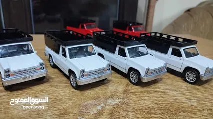  1 مجسم بكم جونيور حديد قياس 1/32 بفتح ابواب وكاله