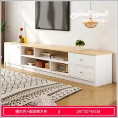 5 طاولة تلفزيون بلون أبيض وخشبي بتخطف الأنظار! المقاس 160*30*40 سم تصميم مودرن وعصري