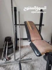  2 اوزان دامبل و بار و تخت  مستعملة للبيع