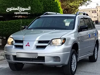  17 ميتسوبيشي آوتلاندر اوتوماتيك 2003 توب نظافة بسعرررر مميززز محرك 2400cc