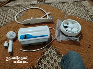  2 قيزر اتمور الأصلي شبه جديد مروحه شفط بتركب على الزجاج شطافه نوعيه اصليه