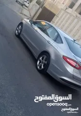  14 فورد فيوجن 2014 هايبرد كلين فحص كامل لون سلفر بحالة الوكالة