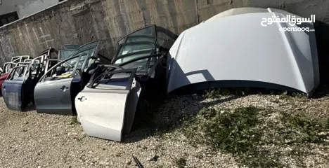  4 اطقم ابواب سيارات كورية +ودبات خلفية +وطبونات خلفية كاملة مع الجسور مع حساس شركة