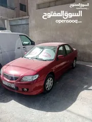  14 مازدا 323 موديل ال2003 باعتبار فحص كامل