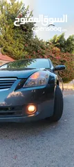  4 نيسان التيما هايبرد 2009 فل كامل مسكر اعلى صنف لون فيراني
