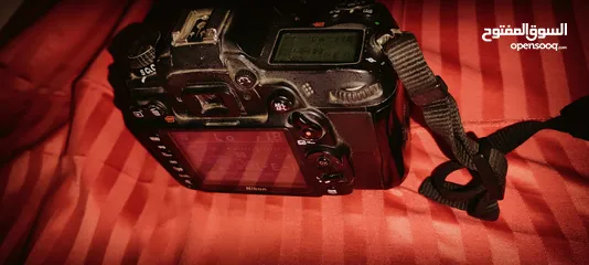  5 Nikon D7000 with 50mm 1.8F lens مع البطارية والشاحن وعدسه شبه جديده