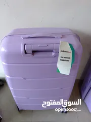  1 purple suitcase used once