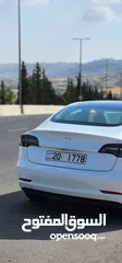  14 Tesla Model 3 Standerd Plus 2022 ابيض وداخليه ابيض جمرك جديد شهر 12‎ بسعر 20 الف بدون الرقم