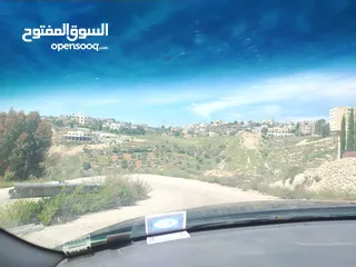  2 دنم و 44 م مقابل مضافة الدرادكة دنم ب القمة عالي