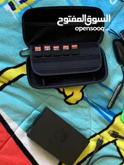  5 نينتيندو سويتش + 2 joy con إضافيتان مع شمعة مع مسكتين مع اغراضه ( بدون ألعاب )و شنتة