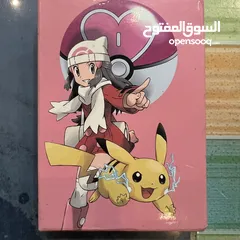  17 كروت بوكيمون والبومات (Pokemon cards and binders)