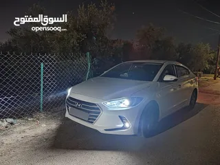  1 هيونداي أفانتي 2018 - لون أبيض - بسعر 11,500 دينار ترخيص عام كامل حتى شهر ستة 2026