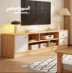  9 خزانة مزنزن تلفزيون خشبية عصرية تصميم أنيق يجمع بين الخشب الطبيعي والأبواب البيضاء ليضيف لمسة .