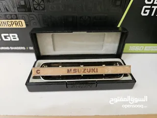  1 Suzuki Manji Harmonica C with the box clean
