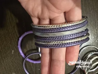  9 اساور بلاستيك بنفسجي، وفضي عدد 15