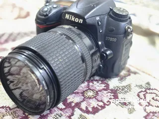  1 نيكون D7000 الوصف بالداخل كامل  سوق المفتوح تحياتي