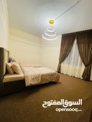 4 Two rooms and a hall for monthly rent in Ajman, overlooking the creek, new furnishings, Al Rashidiya