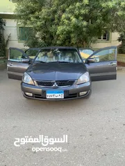  1 لانسر بومه 2008 بحاله ممتازه 1600سي سي