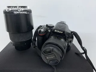  1 كاميرا نيكون D 5200 مع عدسة 70-300 وملحقات