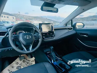  14 تيوتا كورولا هايبرد ترخيص 2022 فل بدون فتحة مميزة  ماتور 1800cc ( بنزين + كهرباء) 170Hp