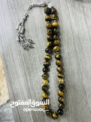  2 عرض خاص سبحه عين النمر ازرق او ذهبي بسعر حرق 33 حبة حلوة مش صغيرة للعلم مع طقم انتيومون مرتب