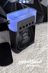  1 مروحة تبريد صغيرة محمولة مع رذاذ ماء بارد