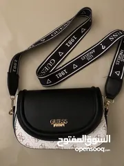  1 women's bag by Guess, new, price 30 dinars