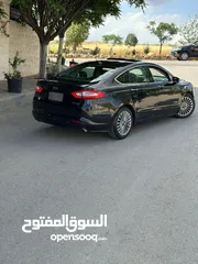  5 فورد فيوجن 2014 هايبرد تيتانيوم فل اضافات ماشيه 70 الف فقط بحاله الشركة