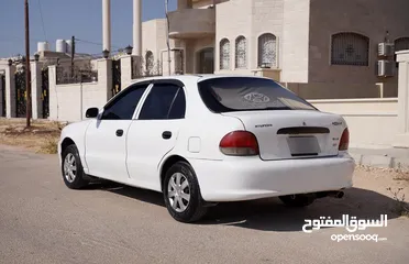  10 هونداي اكسنت هاتشباغ موديل 1998 لون ابيض   بسعر مغري و مميز جدددددا