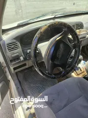  3 كيا سبورتاج موديل 2000 لون ابيض ماتور 2000 توماتيك