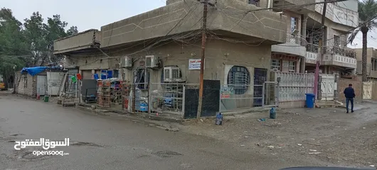  9 للبيع في بغداد الجديدة 50متر فيها ثلاث محلات مؤجرة بناء مسلح 2012على شارع عريض ركن