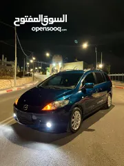  1 مازدا 5 جير عادي 6+1 متور 2000 بنزين رخصه و تامين جديد  عداد قليل فحص نخبب سعرر كااششش
