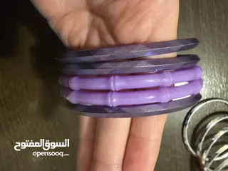  7 اساور بلاستيك بنفسجي، وفضي عدد 15