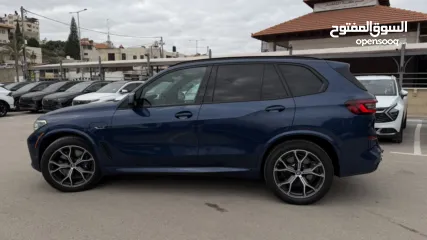  15 BMW X5 ترخيص 2022 ص   محرك 3000 هايبرد plug in/يقطع على الشحنه 80 كيلو متر  399 حصان