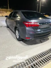  2 تويوتا كورولا موديل2015 فحص كامل لون فيراني مميزه   وغرفه بيج  مميزه جدا  فحص كامل 7 جيد ملاحظه السي