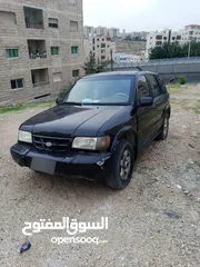  1 كيا سبورتج 2001 لون اسود للبيع