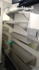  30 stainless steel items like table sink hood, shelves,etc