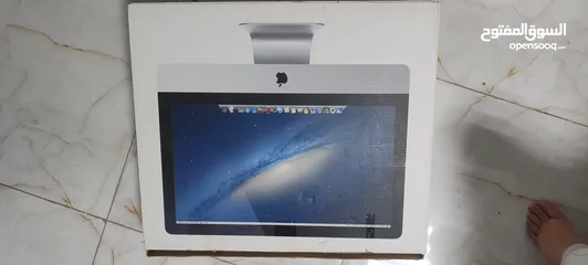  4 i mac with the cartoon and mouse and keyboard