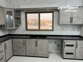  27 مطابخ خشب  مطابخ اللمنيوم أماراتي بجميع الألوان بكفالة 10 سنوات