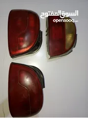  2 طبونات اكسنت 98 امامي وخلفي  ضواو خلفي اكسنت 98 واحد كريستال