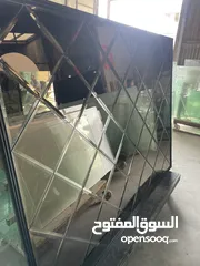  19 تفصيل وتركيب كافة اعمال السكوريت والشور بوكس ومرايا البقلاوة والديكور ومرايا الانارة