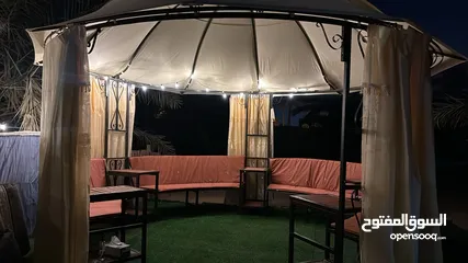  3 Danube home luxury gazebo with curtains and cushions.