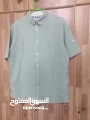  20 قمصان رجالي و وولادي جميع المقاسات ماركة زارا وبولو بأسعار مخفضة القميص ب دينارين