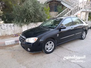  2 كيا سيراتو جولد...موديل 2006..لون اسود..جير اوتومات