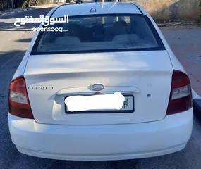  4 كيا سيراتو 2006 ماتور 1600 اوتومات. دهان اصلي مع تصليح عيوب بسيطة في البودي